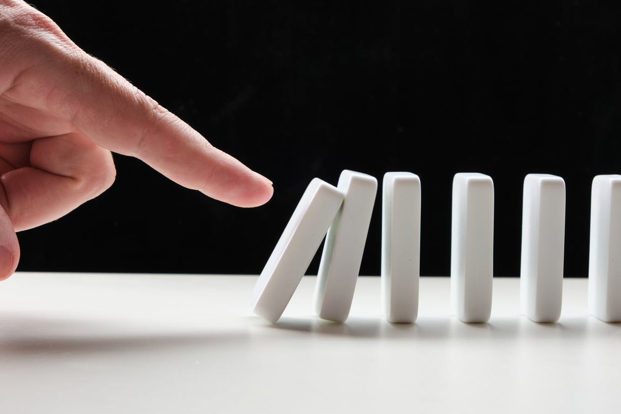Finger initiates a domino effect, symbolizing the cascading impact of legal workflow software